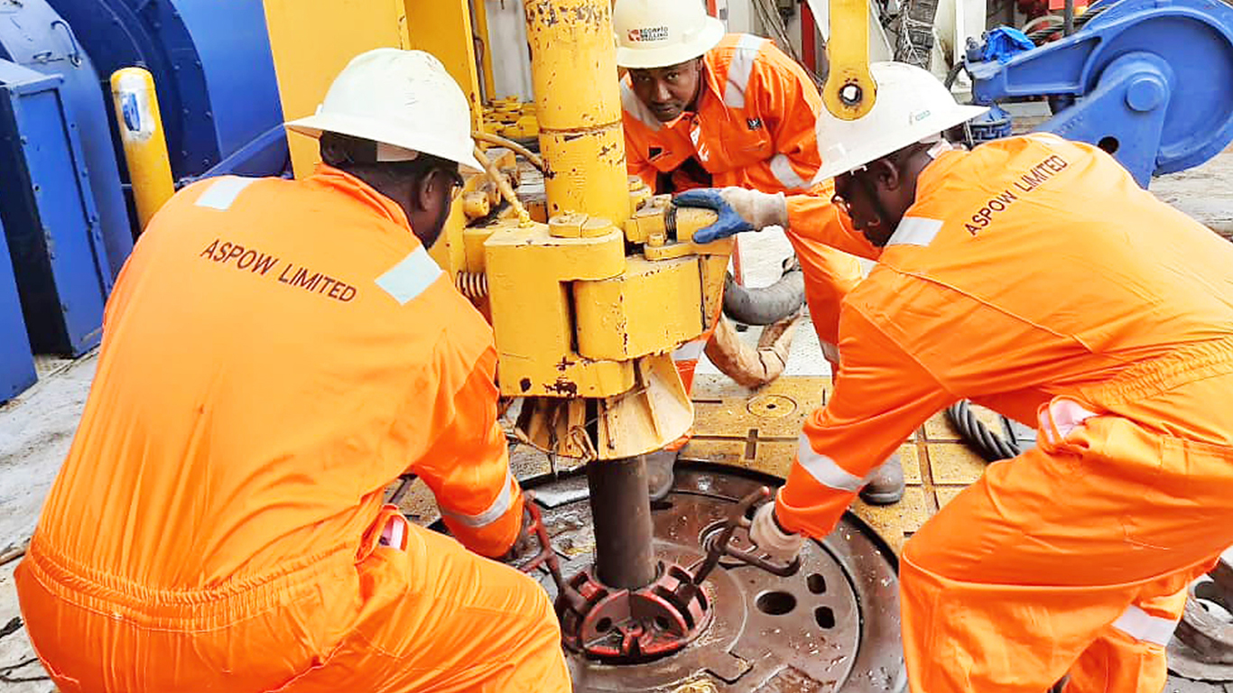 Aspow Limited oil-field workers wearing branded coverall